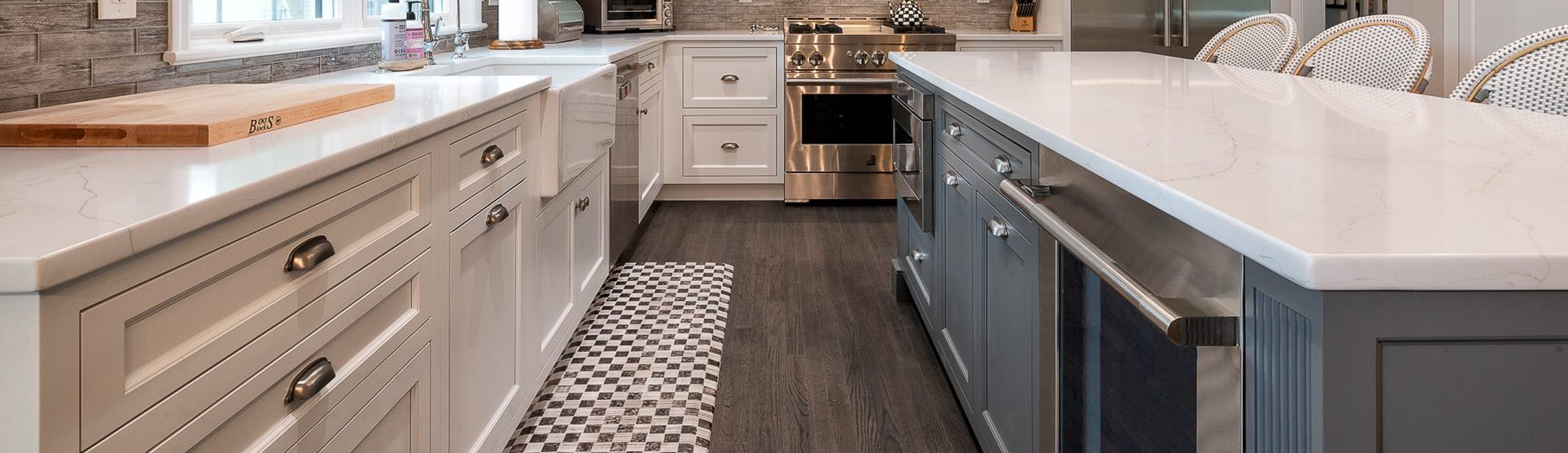 black and white cabinets with white marble countertops